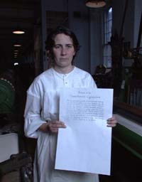 woman holding large printed broadside